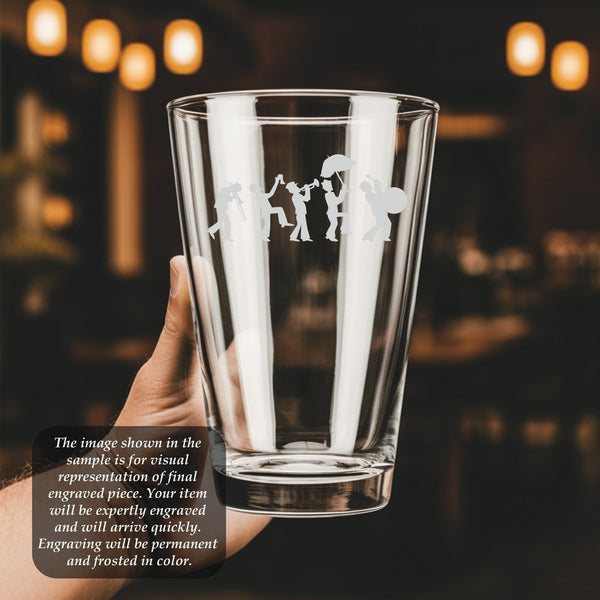 a person holding a glass with a picture of people on it